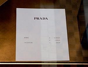 October 17, 2013<br>Sign in the window of Prada.   Borse: 14,300 Euros<br>Translation: Purse for $19,000.