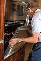 Replace the oven door.  (Easy, though a bit heavy).