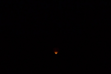 February 15, 2014<br>You can't see much, but then it was miles away at night.  Around Phoenix you can pay (a lot!) for a night balloon flight.  Sounds dangerous, which I assume is why the price is high.