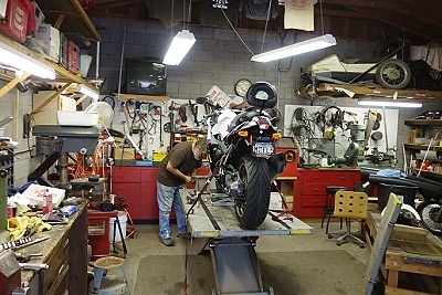January 20, 2015<br>Just a picture of Ken Bone working on the bike in his shop in Apache Junction.