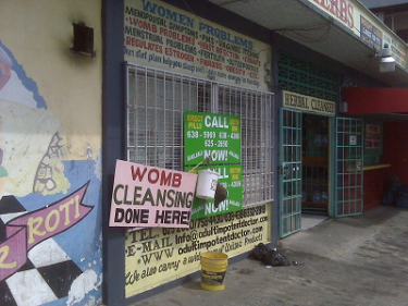 Trinidad, March 2009. So many questions.   What's womb cleansing?  What's that bucket and hat for?  What's an 'erection drink'? Does the US have shops that specialize in "Women Problems"? 
