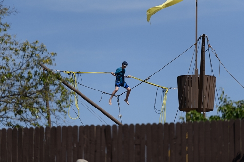 March 31, 2019<br>Off behind the fence, people would pop up on bungees.   Just like the olden days.