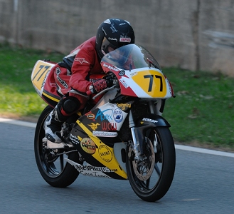 Smallest rider (Draik Beauchamp) on the track, on a 125.  Embarrassing the bigger bikes in the turns.