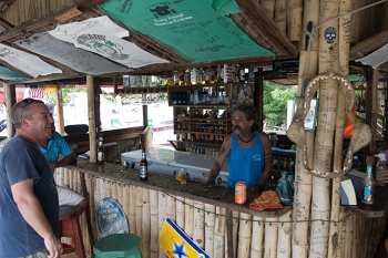 Captain Ed tends bar at Hole in the Wall.<br>October 7, 2017