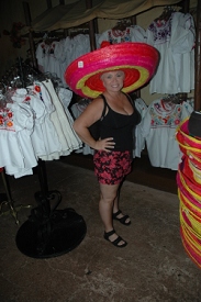 Epcot Center.  The hat looks big on her...